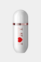 Carolina Herrera's 212 VIP Rose perfume features a white, rounded bottle with a rose gold band and "I ? NY" design filled with sparkly red glitter. The sleek, sophisticated design combines elegance with playful femininity, set against a simple white background.