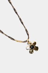Dikochi - Gold-Tone Flower Pendant Necklace with a Black Center Stone